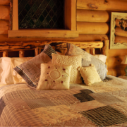 Lakeside-Living_Manitowish-Waters_Northwoods-WI_Bedding-Basics_Log-Cabin-Bedroom_Patchwork-Quilt_Various-Decorative-Pillows